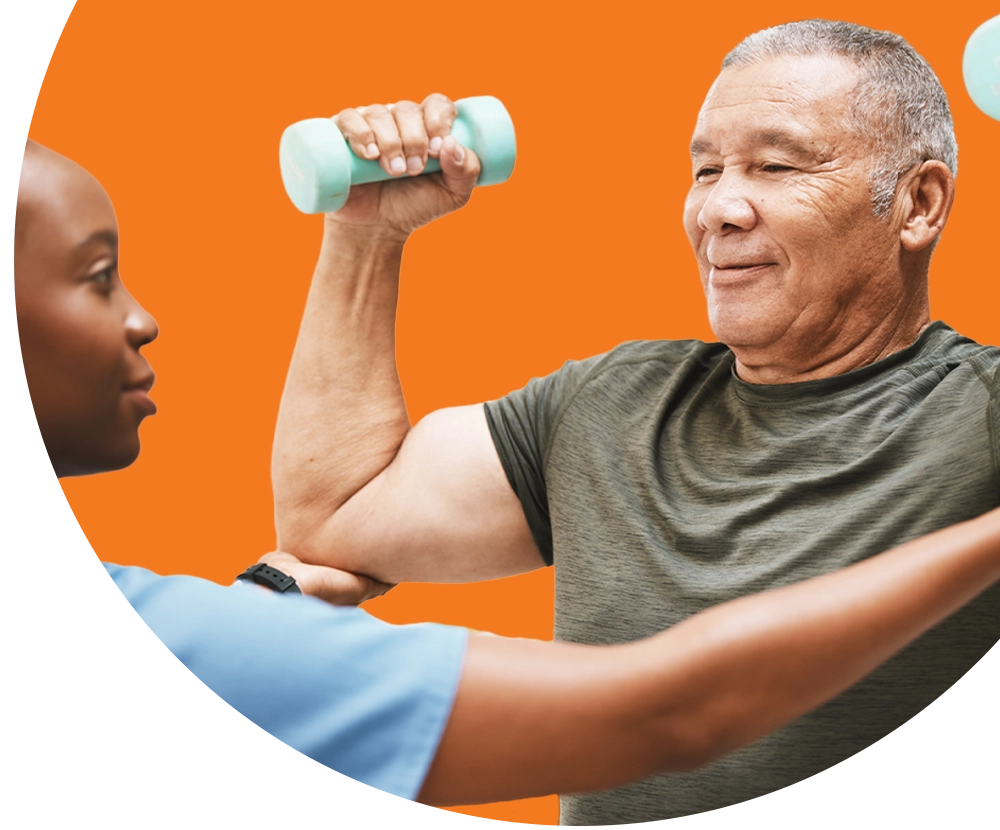 A medical professional wearing scrubs helping an elderly man exercise